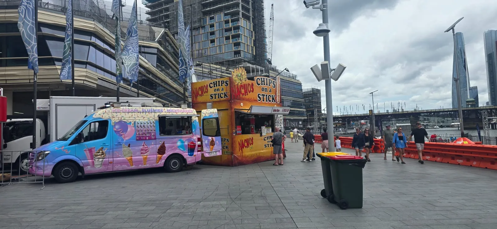 An ice cream van and a nachos stall on the waterfront promenade at Darling Harbour